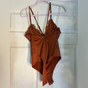 Sexy/party dark orange bodysuit